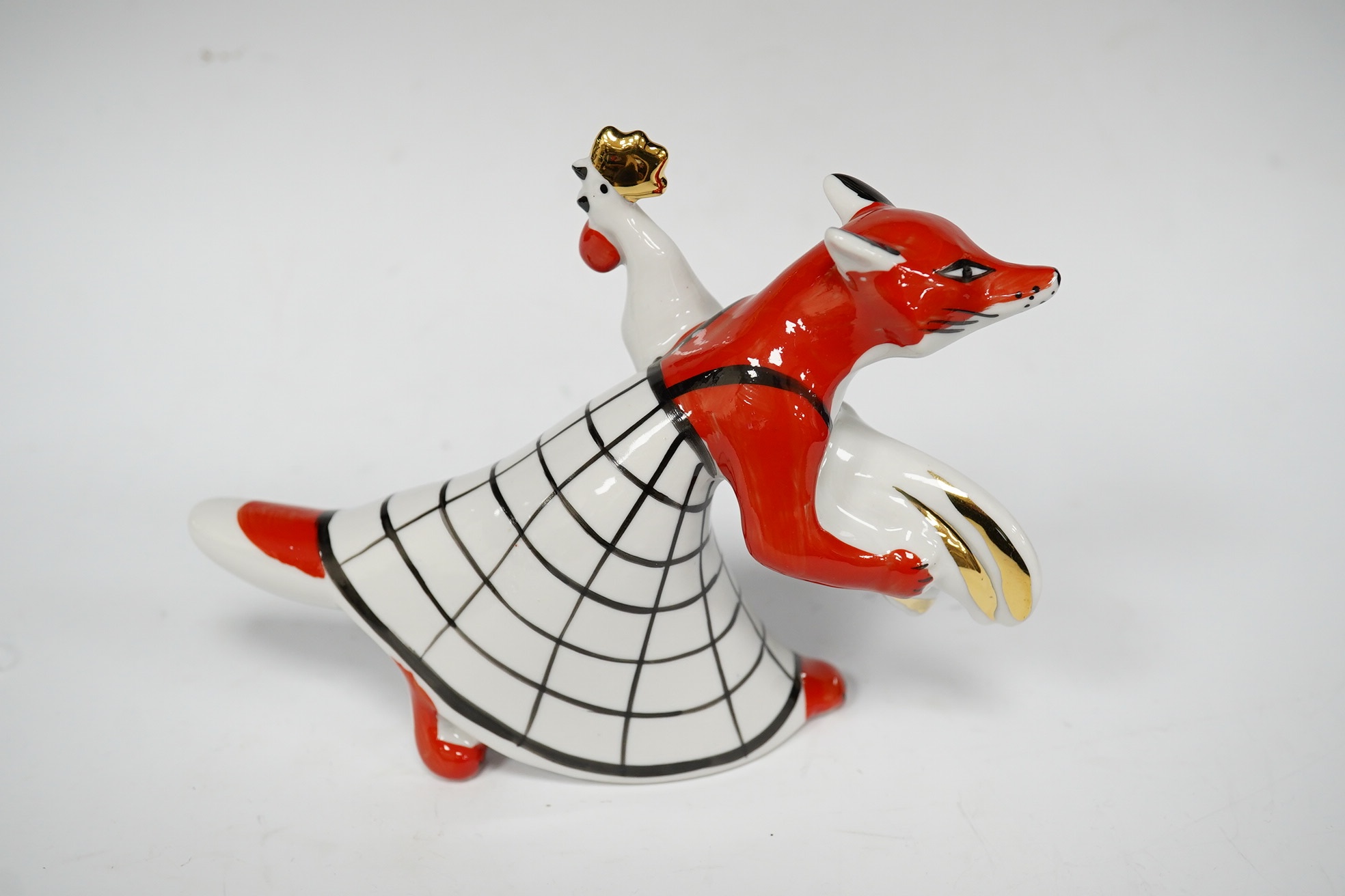 A Russian porcelain fox and rooster figure, stamped to the base, 18cm wide. Condition - good